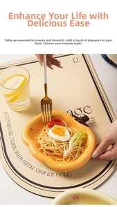 Detail of pumpkin-shaped orange ceramic plate with white polka dots serving pasta