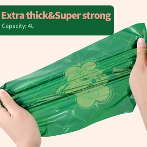 Durable green biodegradable EPI pet waste bag being stretched to show high strength