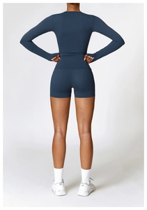 Rear view of tight-fitting navy blue sports top and shorts set in professional lighting