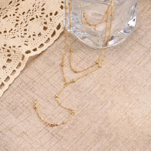 Elegant gold layered beaded necklace with a long Y-shape tassel pendant for women