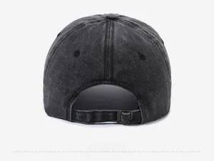 Detailed back view of vintage washed canvas baseball cap with adjustable metal buckle