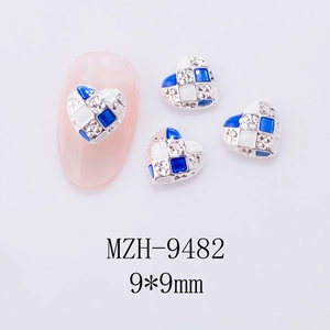 Blue and white checkerboard heart nail charms with rhinestones in 9x9mm size detail