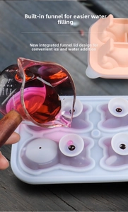 Macro shot of silicone pig ice mold featuring integrated funnel lid for easy water filling