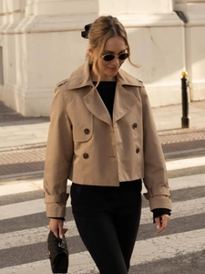 Women's double-breasted short trench coat in beige with lapel collar and sleeve straps
