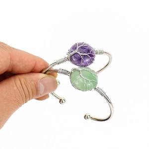 Handmade silver wire wrapped tree of life bracelets with purple and green crystals
