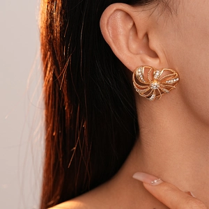 Elegance with gold metallic windmill heart earrings and sparkling cubic zirconia for women