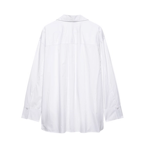 Detail of white cotton shirt back showing dropped shoulder seams and a central box pleat