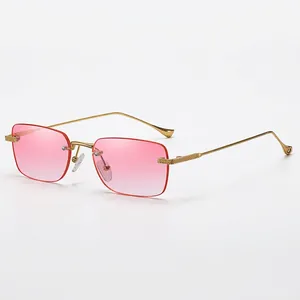 Rimless square sunglasses with pink gradient lenses and slim golden metal frames