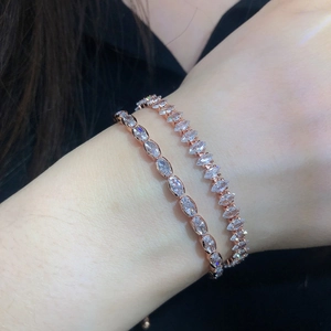 Macro detail of rose gold marquise zircon tennis bracelets showing fine crystal settings