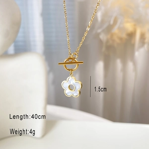 Macro detail of golden flower pendant necklace with OT toggle clasp and size dimensions