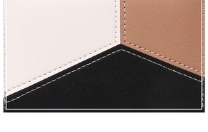 Vue macro détaillée de la couture du cuir tricolore et de l'artisanat de couture blanc