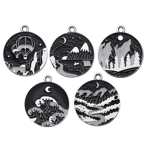 Five black and white circular metal pendants with nature landscape patterns for DIY jewelry