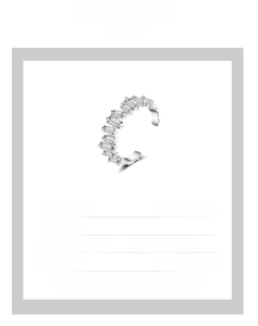 Detail of adjustable micro-pave zircon ring showing 0.6cm width and multicolor sparkle
