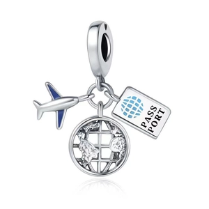 Macro detail of silver travel charms featuring a plane, globe, and passport with blue accents