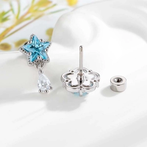 Screw-back cartilage stud with blue star zircon and white teardrop drop in silver finish