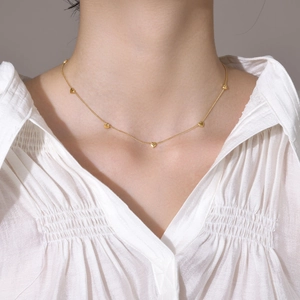 Elegant 18K gold plated necklace featuring multiple mini heart pendants on a fine chain