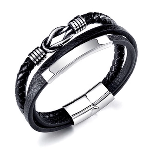 Detail of men's double-layer black braided leather bracelet with silver magnetic clasp