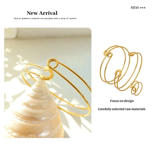 Detail of gold safety pin style bracelets shown in both lifestyle and studio product shots