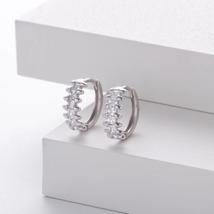 Macro shot of silver S925 earrings with sparkling micro-pave cubic zirconia stones