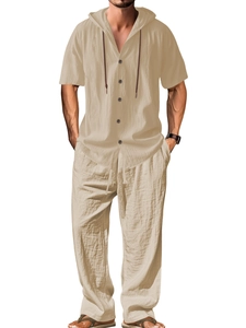 Detail of men's beige cotton linen set featuring hooded short sleeve shirt and long pants