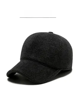 Detail of dark grey wool baseball cap showing thick warm material and SPORT metal logo