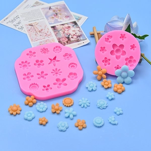 Pink floral silicone mold kit with various flower shapes for DIY cake and resin decor