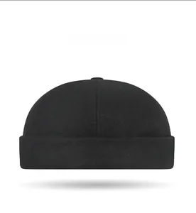 Front angle view of a black woolen docker hat with fleece lining for winter warmth