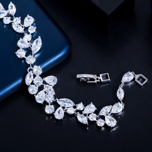 Macro shot of sparkling pear and marquise-cut zircons on a silver bracelet with clasp