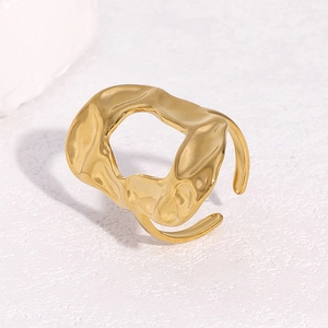 Adjustable golden stainless steel open ring with a unique irregular lava flow texture