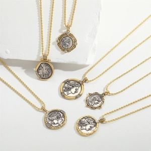 Vintage gold twist chain necklace featuring antique Roman coin pendant relief detail