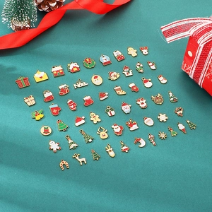 Detailed close-up of colorful Christmas charms including Santa, Reindeer, and Noel motifs