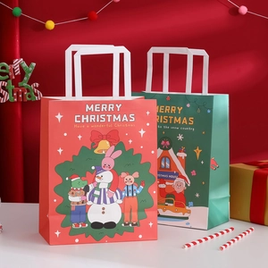 Red and green Christmas gift bags with handles and Merry Christmas festive print