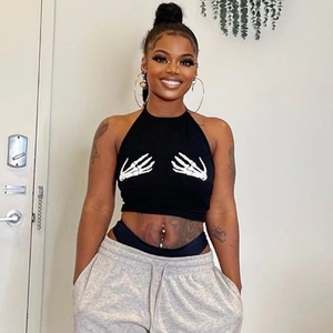 Black halter neck crop top featuring white skeletal hand graphic prints in streetwear style