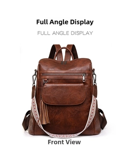 Detail view of brown vintage PU leather backpack with ethnic style woven wide strap