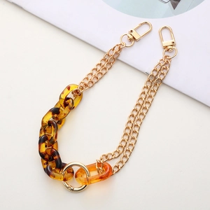 Detail of acrylic leopard print chain with gold lobster clasps for phone case and bags