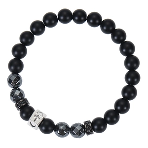 Close-up of black matte beads with silver cross and faceted grey stones on bracelet