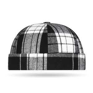 Classic black and white checkered docker hat with a six-panel crown and upturned brim