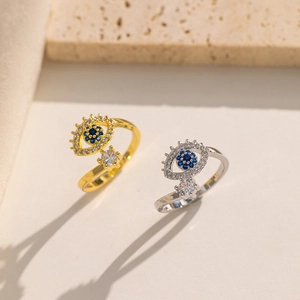 Minimalist evil eye rings in gold and silver finish with blue and clear zircon accents