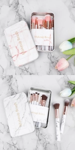 Detailed top view of portable marble makeup brush set with elegant tin storage box