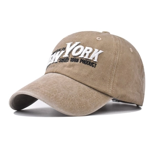 Detailed side view of vintage washed cotton baseball cap with New York 1988 embroidery