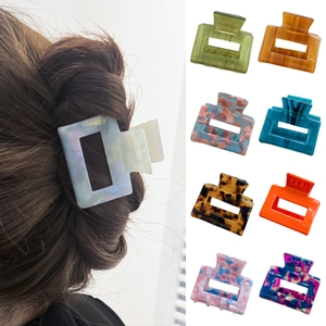 Rectangular acetate hair claw clips in assorted marble colors for elegant hair styling