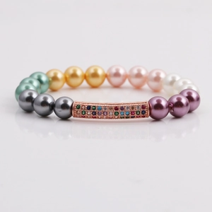 Bracelet pour femme avec perles colorées et tube en cuivre or rose serti de zircons