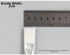 Detail showing a 2cm wide flat nylon brush head with silver metal ferrule for mud mask application