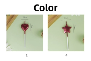 Close-up of metallic red heart and star birthday candles with long white plastic sticks