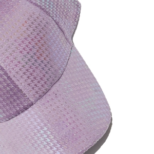 Macro view of purple holographic scale texture on baseball cap brim and crown details