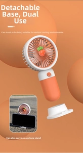 Carrot themed mini USB fan with detachable base that functions as a mobile phone stand