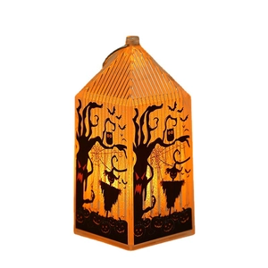 Halloween pumpkin lantern with glowing orange light and black silhouette patterns