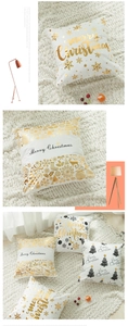 Detail of soft white Christmas pillowcase with golden Merry Christmas and reindeer print