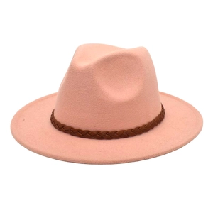 Detailed view of pink wool fedora hat featuring a brown braided leather band accessory