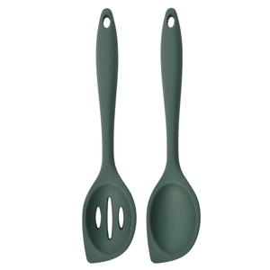 Detail of dark green silicone kitchen tool set including a slotted and solid spoon